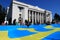 A huge Crimean Tatar flag was unfurled near the Verkhovna Rada of Ukraine. Crimean Tatars hold a large blue flag with a yellow