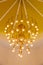 Huge crystal glass chandeliers hanging on ballroom dance in wedding ceremony date