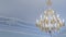 A huge crystal gold chandelier with candles. Luxury chandelier with crystal pendants. Space for text. Expensive concepts