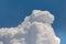 Huge cumulonimbus high in the blue sky