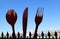 A huge cutlery sets in front of a city.