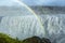 Huge Dettifoss waterfall with a double rainbow, Iceland