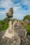 Huge dragon statue at limestone mountain top near Hang Mua view