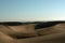 The huge Dune of the desert of Maspalomas on the Canary Islands leading up to the Atlantic Ocean