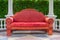 Huge empty red sofa outdoor
