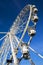 Huge ferris wheel at blue sky