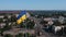 Huge flagpole in the city. Opening ceremony aerial shot