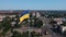 Huge flagpole in the city. Opening ceremony aerial shot