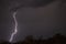 Huge fork lightnings and thunder during heavy summer storm.