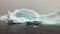 Huge giant iceberg and ice floe in ocean of Antarctica.