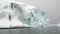 Huge giant iceberg and ice floe in ocean of Antarctica.