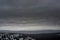 Huge, gray clouds slowly float across the sky, over the mountain range of the Taganay national Park, in the early winter morning