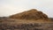 a huge haystack lies on the ground