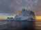 A huge high breakaway glacier drifts in the southern ocean off the coast of Antarctica at sunset, the Antarctic