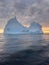 A huge high breakaway glacier drifts in the southern ocean off the coast of Antarctica at sunset, the Antarctic