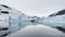 A huge high breakaway glacier is passing by in the southern ocean off the coast of Antarctica, the Antarctic Peninsula