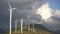 Huge high wind turbines on the hill, against the backdrop of an epic sky. Wind power plant in northern Montenegro.