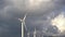 Huge high wind turbines on the hill, against the backdrop of an epic sky. Wind power plant in northern Montenegro.