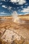 Huge hot geyser. Hot spring and geyser at Sajama National Park in Bolivia. Geothermal activity andean geysers in geysers valley,