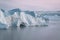 Huge icebergs of different forms in the gulf of Greenland. The biggest glacier on a planet Jakobshavn. Studying of a