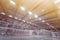 Huge industrial warehouse with stacks of vacuum-packed water or beer packages on pallets.