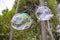 Huge lots of soap bubbles multicolored bright reflections water summer bokeh