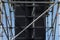 Huge loudspeakers of sound equipment on metal frame construction under blue sky. Concert or show audio system closeup image