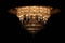 Huge luxurious crystal electric chandelier isolated on a black background