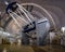 Huge modern professional astrophysical telescope under dome of observatory