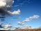 Huge monsoon clouds in winter over the snow covered Santa Catalina mountains at sunset in Tucson Arizona