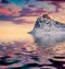 Huge mountain peak reflected in calm waters of Norwegian sea, Vastvagoy.