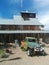 Huge multi-story wooden barn in desert with vintage truck