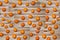 A huge number of scattered oranges on the boards for the background