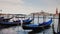 A huge ocean liner sails in the Bay of Venice, the gondolas rock on the waves in the foreground