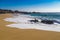 Huge ocean waves crushing on rocks in Garrapata State Beach in C