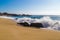 Huge ocean waves crushing on rocks in Garrapata State Beach in C