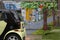 Huge painted mural of colorful victorian rowhouses sits behind a real car