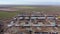 Huge parts of the wind turbines on the ground near the construction site, 4k