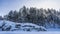 Huge picturesque boulders covered with layers of snow.