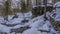 Huge picturesque boulders in the forest are covered with snow.