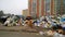 Huge pile of garbage near houses