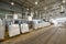 Huge plastic bags with product on pallets at recycling plant