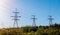 A huge pylon against blue sky and sun rays.