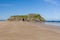 Huge, quiet sandy beach in summer Tenby`s Castle Beach, Wales