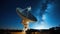 Huge radio telescope aimed directly into sky in middle of deserted desert catching signals