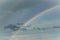 Huge rainbow in the sky with clouds