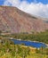 The huge red mountain and blue lake Tioga