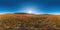 Huge Red poppy field on the mountains background seamless spherical panorama. Nobody. Poppies and wildflower meadow