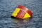 Huge red and yellow buoy