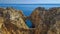 Huge rock at the cliff beach of Praia da Marinha, lovely hidden beach near Lagoa Algarve Portugal